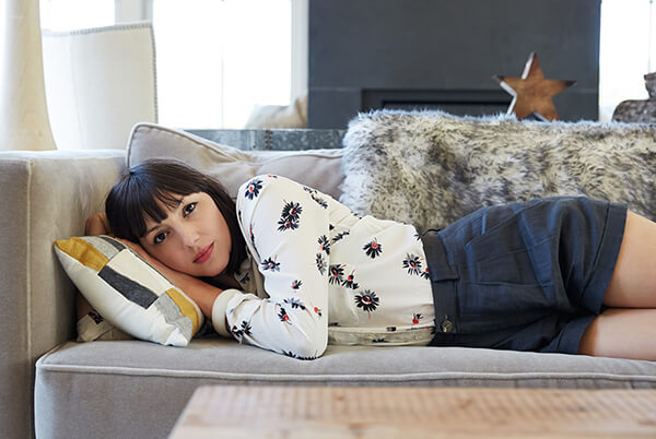 Women laying on couch